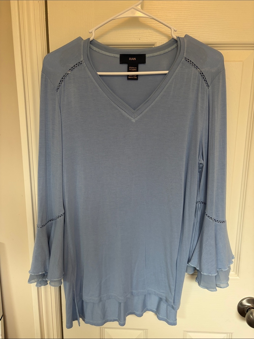 Rain Women's Light Blue V-Neck Long Sleeve Ruffle Hem Top